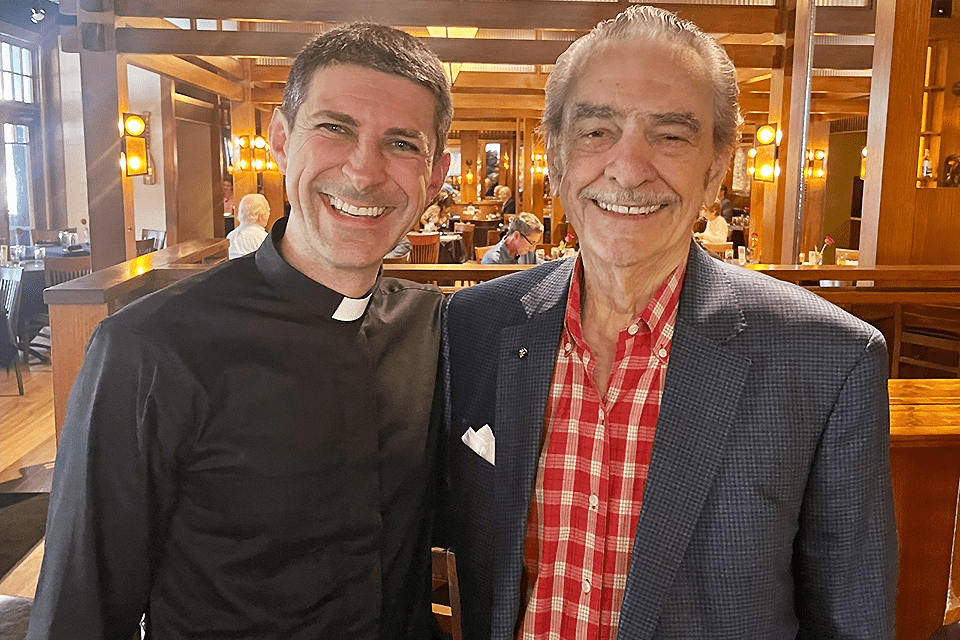 Al Hrubetz and Fr. Matthew Baugh, S.J. pose for a photo.